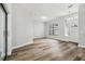 Open living room with new wood floors and a view of the front entry at 930 Balsamina Dr, Brandon, FL 33510