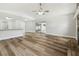 Open living room with sliding glass doors to the backyard and a brick fireplace at 930 Balsamina Dr, Brandon, FL 33510