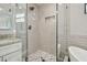 Close up of the stand up shower with a shower head and a built in niche at 930 Balsamina Dr, Brandon, FL 33510