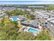 Community features two sparkling pools, well-kept landscaping, and ample parking in an accessible aerial view at 9790 66Th N St # 160, Pinellas Park, FL 33782