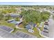 Aerial shot showcasing community amenities: a pool, a covered shuffleboard, a covered bocce court, and parking spaces at 9790 66Th N St # 160, Pinellas Park, FL 33782