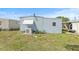 Exterior rear view of property with green grass at 9790 66Th N St # 160, Pinellas Park, FL 33782