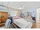 Comfortable bedroom features a ceiling fan, closet, and dresser at 9790 66Th N St # 160, Pinellas Park, FL 33782
