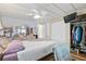 Spacious bedroom with ceiling fan, closet, and dresser provides ample storage at 9790 66Th N St # 160, Pinellas Park, FL 33782