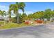 Welcome home sign with landscaping and stone waterfall feature at 9790 66Th N St # 160, Pinellas Park, FL 33782