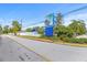 Eye-catching community sign with blue accents and lush landscaping, welcoming residents and visitors alike at 9790 66Th N St # 160, Pinellas Park, FL 33782