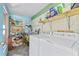 Laundry room with washer, dryer, shelving, and plenty of storage space at 9790 66Th N St # 160, Pinellas Park, FL 33782