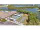 Overhead view of community shuffleboard and bocce ball courts near a lake at 9950 62Nd N Ter # 316, St Petersburg, FL 33708