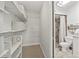 A bathroom features a shower, toilet, and white vanity and sink with decorative mirror at 9950 62Nd N Ter # 316, St Petersburg, FL 33708