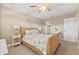 Bedroom with neutral walls and decor, wicker bed, ceiling fan, and coastal accents at 9950 62Nd N Ter # 316, St Petersburg, FL 33708