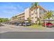 Attractive condo building with covered parking and well-kept landscaping near the roadway at 9950 62Nd N Ter # 316, St Petersburg, FL 33708