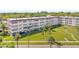 Beautifully landscaped condo complex with mature palm trees and well-manicured lawn at 9950 62Nd N Ter # 316, St Petersburg, FL 33708