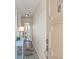 Hallway with light-toned walls, an accent table, and tile flooring at 9950 62Nd N Ter # 316, St Petersburg, FL 33708