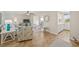 Open-concept living room showcasing tile floors and an adjacent dining area at 9950 62Nd N Ter # 316, St Petersburg, FL 33708