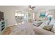 Bright and airy living room with decor, leading into the dining area at 9950 62Nd N Ter # 316, St Petersburg, FL 33708