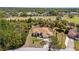 A beautiful aerial view of the house shows the landscaping and nearby golf course at 5202 Lydia Ct, Spring Hill, FL 34608