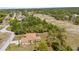 This aerial shot showcases the home's private backyard and nearby trees at 5202 Lydia Ct, Spring Hill, FL 34608