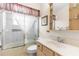 Bathroom featuring a shower-tub combination with curtain and sink with vanity at 5202 Lydia Ct, Spring Hill, FL 34608