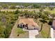 Lovely home with manicured lawn, fountain, and three-car garage at 5202 Lydia Ct, Spring Hill, FL 34608