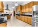 Spacious kitchen with stainless steel appliances, modern countertops, and custom cabinets at 5202 Lydia Ct, Spring Hill, FL 34608