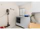 Laundry room with washer, dryer, and vacuum; storage area at 5202 Lydia Ct, Spring Hill, FL 34608