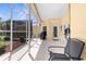 Spacious screened-in lanai featuring a tile floor, covered ceiling, and outdoor seating at 5202 Lydia Ct, Spring Hill, FL 34608