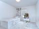 Well-lit bedroom with single bed, functional desk, and neutral color scheme at 10822 Verawood Dr, Riverview, FL 33579