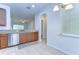 Kitchen with granite countertops, stainless steel appliances, and a view into the living space at 10822 Verawood Dr, Riverview, FL 33579