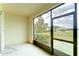 View of a screened-in lanai, providing a relaxing outdoor living space with a view of the community at 10822 Verawood Dr, Riverview, FL 33579