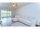 Open living room with a comfortable sectional sofa and sliding glass doors to screened lanai at 10822 Verawood Dr, Riverview, FL 33579