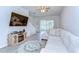 Bright living room features a comfortable sectional sofa and entertainment center, perfect for relaxation at 10822 Verawood Dr, Riverview, FL 33579