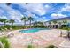 Resort-style community pool with ample seating and palm trees, creating a vacation-like atmosphere at 10822 Verawood Dr, Riverview, FL 33579