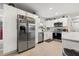 Modern kitchen featuring stainless steel appliances, white cabinetry, and ample counter space at 1136 Serpentine S Dr, St Petersburg, FL 33705