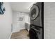 Well-equipped laundry room with modern appliances and a small adjacent bathroom at 1136 Serpentine S Dr, St Petersburg, FL 33705