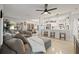 Bright and airy living room with an open floor plan, seamlessly connecting to the modern kitchen area at 1136 Serpentine S Dr, St Petersburg, FL 33705