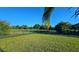 Enjoy this oversized backyard featuring a serene pond, mature trees and wrought iron fence at 11412 Autumn Leaf Way, Bradenton, FL 34212