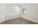 Empty bedroom showing large window, neutral paint, and trim at 11412 Autumn Leaf Way, Bradenton, FL 34212