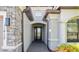 Stunning home entryway featuring stone accents and an inviting covered porch at 11412 Autumn Leaf Way, Bradenton, FL 34212