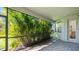 Enjoy the outdoors from this screened in patio and its lush green view at 11412 Autumn Leaf Way, Bradenton, FL 34212