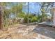 Spacious backyard featuring a wooden deck and mature trees offering plenty of shade and privacy at 1250 12Th Sw Ct, Largo, FL 33770