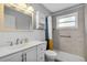Modern bathroom with vanity, toilet, and shower features updated fixtures and tiling at 1250 12Th Sw Ct, Largo, FL 33770