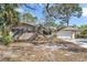 Charming single-story home with a mature tree-lined yard and brick accent, creating a serene and inviting curb appeal at 1250 12Th Sw Ct, Largo, FL 33770