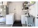 Functional laundry area equipped with a washer, dryer, utility sink and water heater at 1250 12Th Sw Ct, Largo, FL 33770