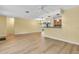 A bright and open living space featuring wood-look floors, ample natural light, and seamless flow between rooms at 1250 12Th Sw Ct, Largo, FL 33770
