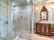 Bathroom features glass shower and carved vanity at 1403 W Watrous Ave, Tampa, FL 33606