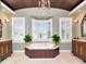 Luxury bathroom with spa tub under bay windows and dual vanities provides a relaxing retreat at 1403 W Watrous Ave, Tampa, FL 33606
