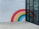 Modern building featuring a vibrant rainbow mural with the motivational quote 'Dreams Really Do Come True' at 1403 W Watrous Ave, Tampa, FL 33606