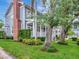 Charming home featuring a welcoming front porch with swing, manicured lawn and professional landscaping at 1403 W Watrous Ave, Tampa, FL 33606