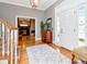 Elegant foyer features hardwood floors, staircase, and a view into a living room with fireplace at 1403 W Watrous Ave, Tampa, FL 33606