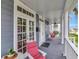 Inviting front porch features a swing, seating, and classic architectural details at 1403 W Watrous Ave, Tampa, FL 33606